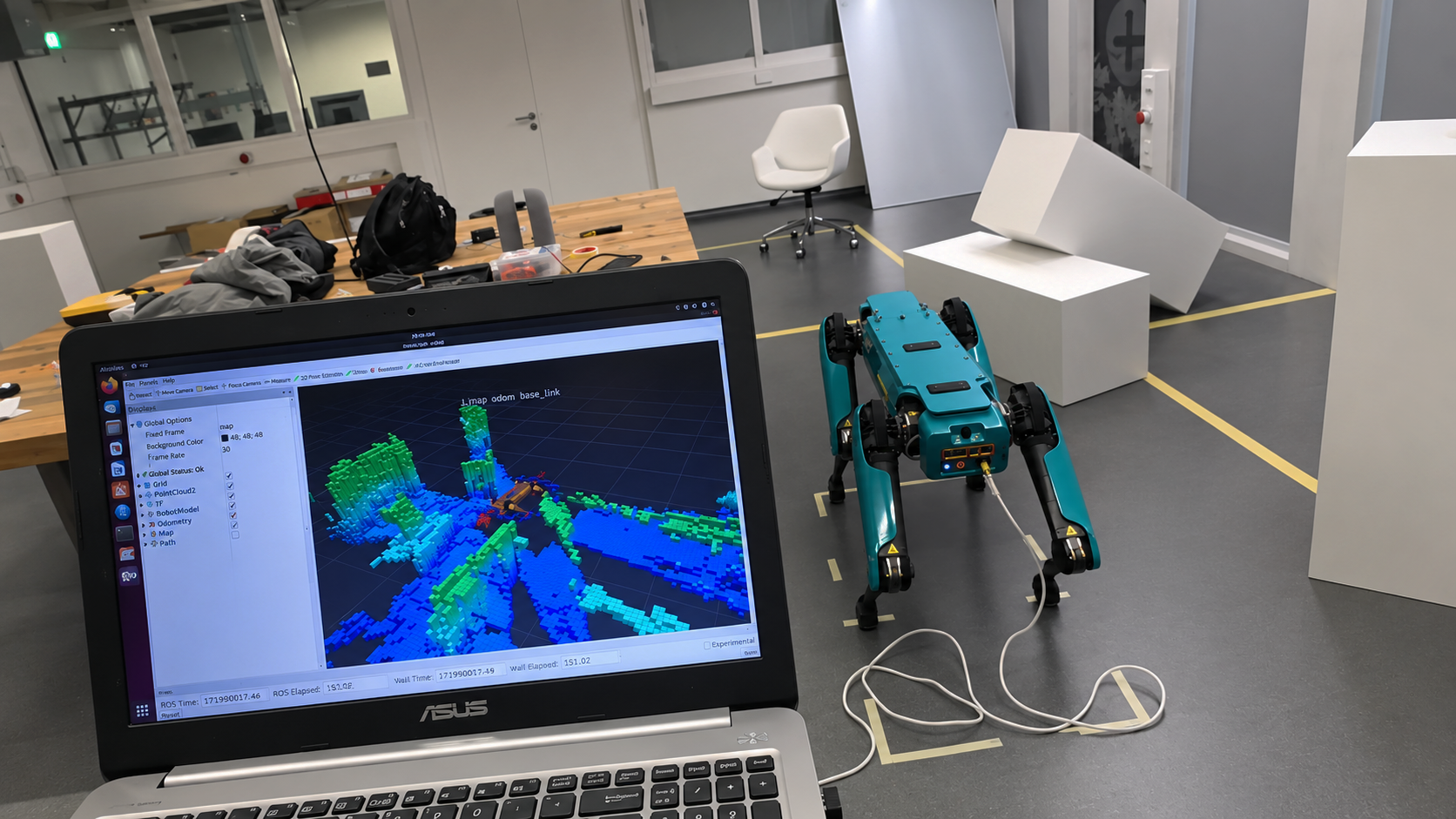 Spot robot and laptop during an indoor scanning session